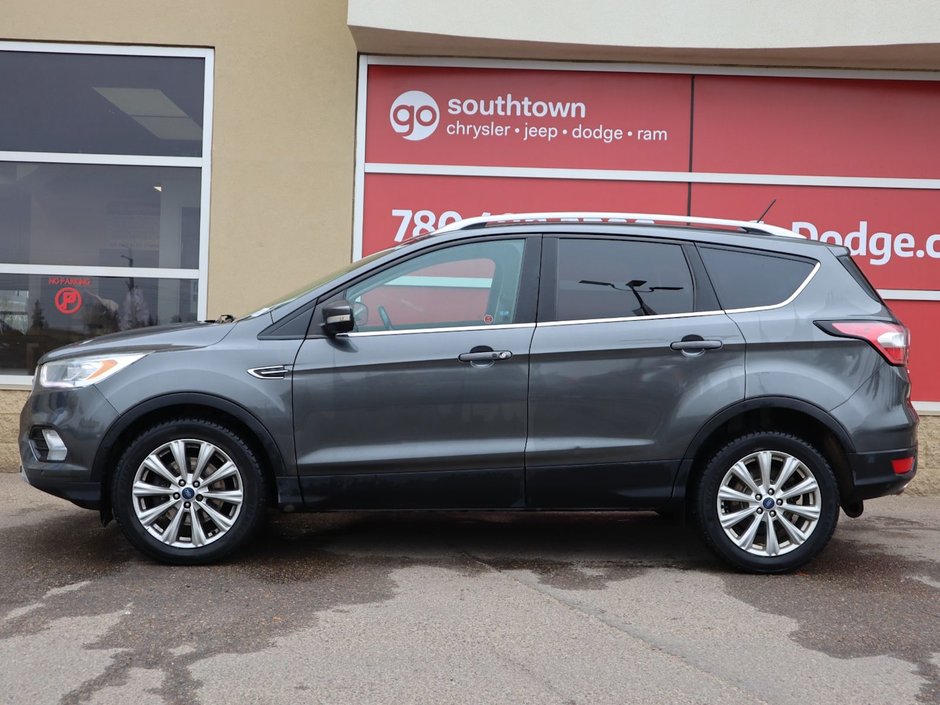 2018 Ford Escape TITANIUM IN GREY EQUIPPED WITH A 2.0L TURBO I4 , 4WD , 6SPD AUTO ,  LEATHER , PANO ROOF, NAV, REMOTE START , PREMIUM AUDIO , DUA-4