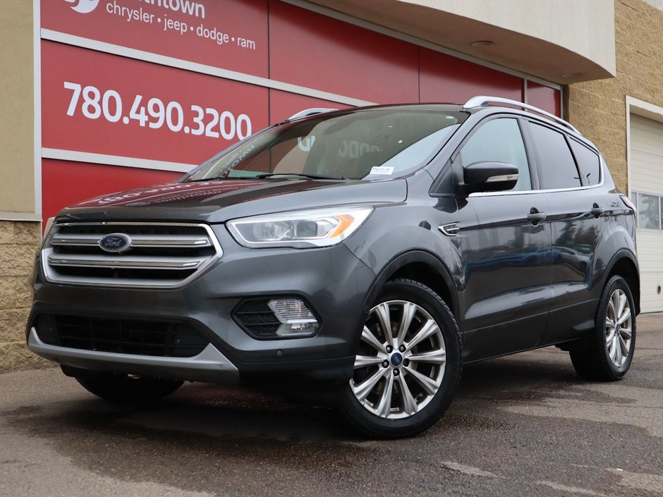 2018 Ford Escape TITANIUM IN GREY EQUIPPED WITH A 2.0L TURBO I4 , 4WD , 6SPD AUTO ,  LEATHER , PANO ROOF, NAV, REMOTE START , PREMIUM AUDIO , DUA-0