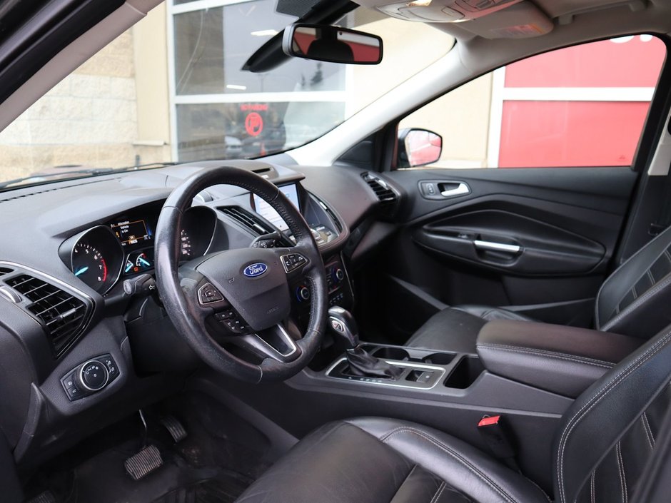 2018 Ford Escape TITANIUM IN GREY EQUIPPED WITH A 2.0L TURBO I4 , 4WD , 6SPD AUTO ,  LEATHER , PANO ROOF, NAV, REMOTE START , PREMIUM AUDIO , DUA-12