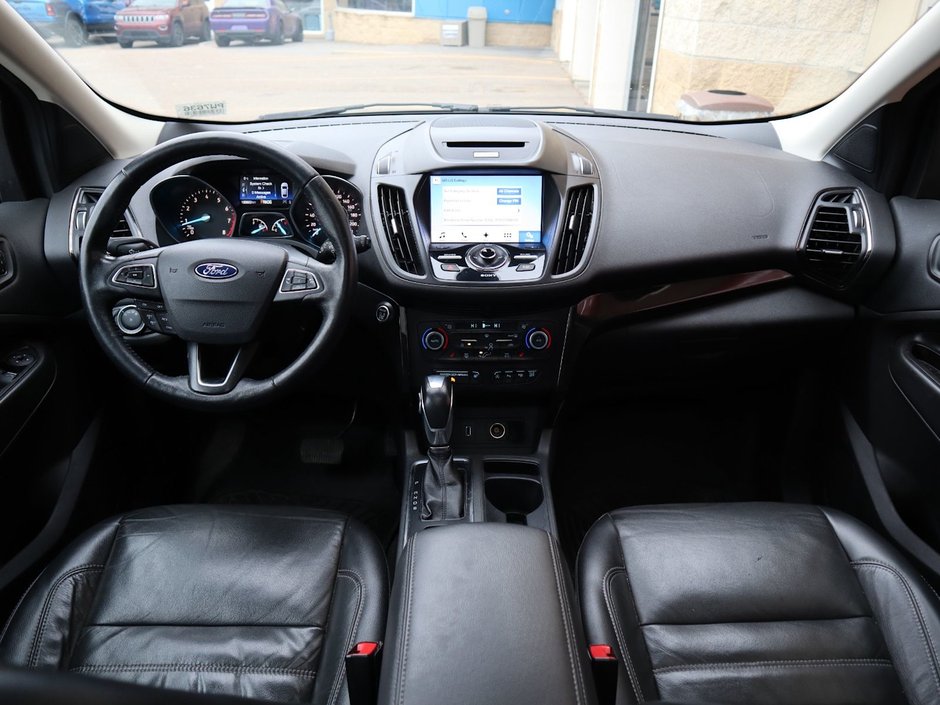 2018 Ford Escape TITANIUM IN GREY EQUIPPED WITH A 2.0L TURBO I4 , 4WD , 6SPD AUTO ,  LEATHER , PANO ROOF, NAV, REMOTE START , PREMIUM AUDIO , DUA-18