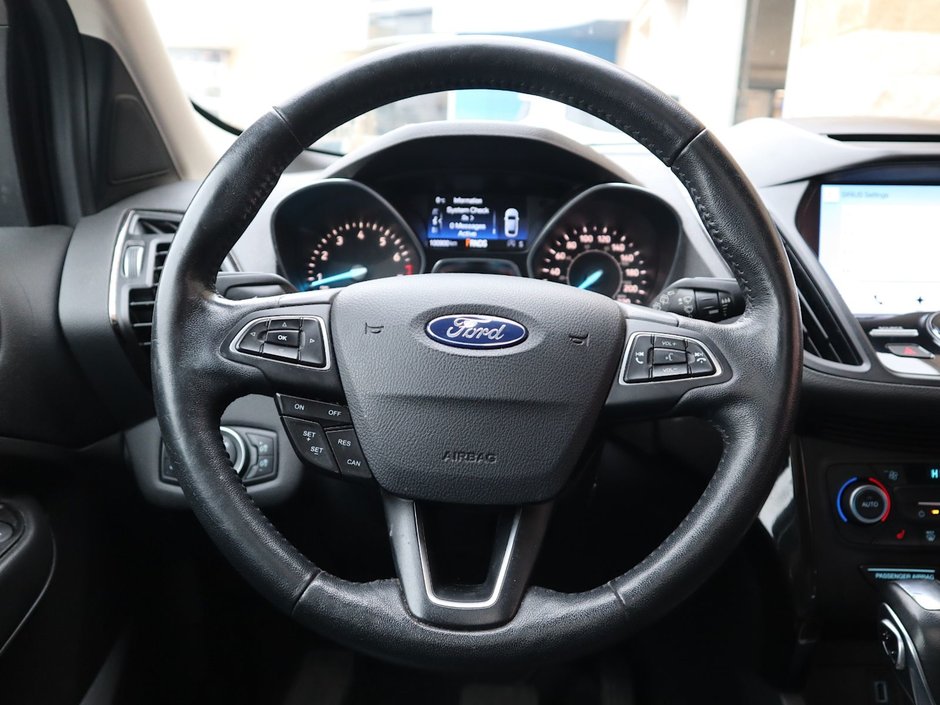 2018 Ford Escape TITANIUM IN GREY EQUIPPED WITH A 2.0L TURBO I4 , 4WD , 6SPD AUTO ,  LEATHER , PANO ROOF, NAV, REMOTE START , PREMIUM AUDIO , DUA-20