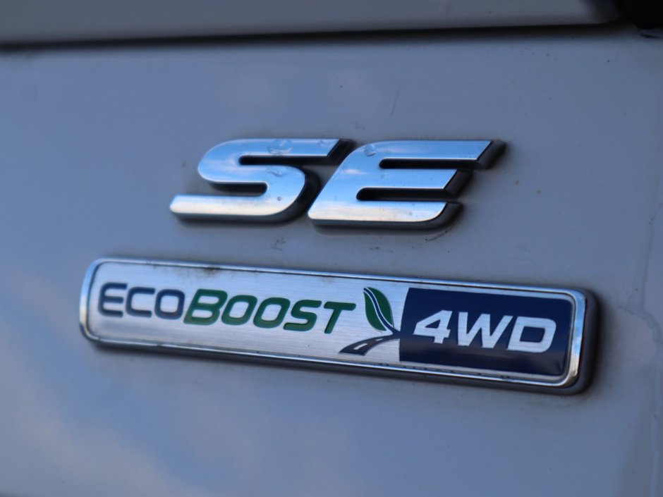 2019 Ford Escape SE IN WHITE EQUIPPED WITH A 1.5L TURBO I4 , 4X4 , 6SPD AUTO , CLOTH HEATED SEATS , DUAL ZONE AC , CRUISE , BACKUP CAM , SW CONTR-13