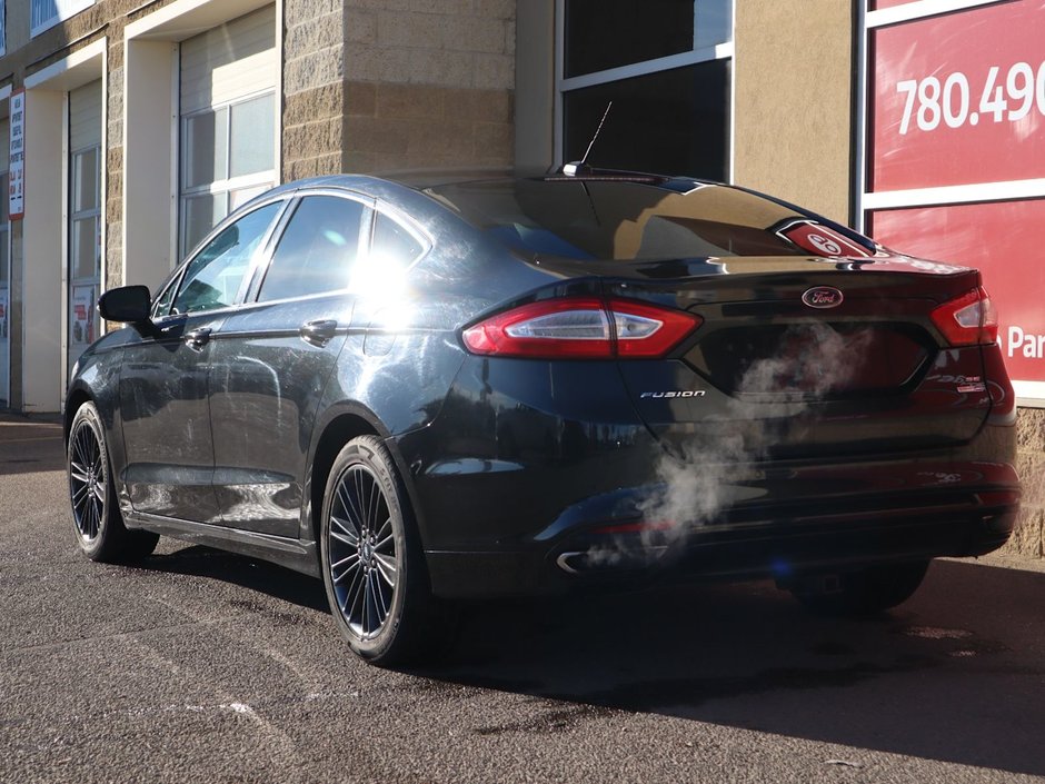2014 Ford Fusion SE IN BLACK EQUIPPED WITH A 2.0L ECOBOOST I4 , AWD , 6SPD AUTO , LEATHER HEATED SEATS , BLUETOOTH , SW CONTROLS , SUNROOF , 18IN-7