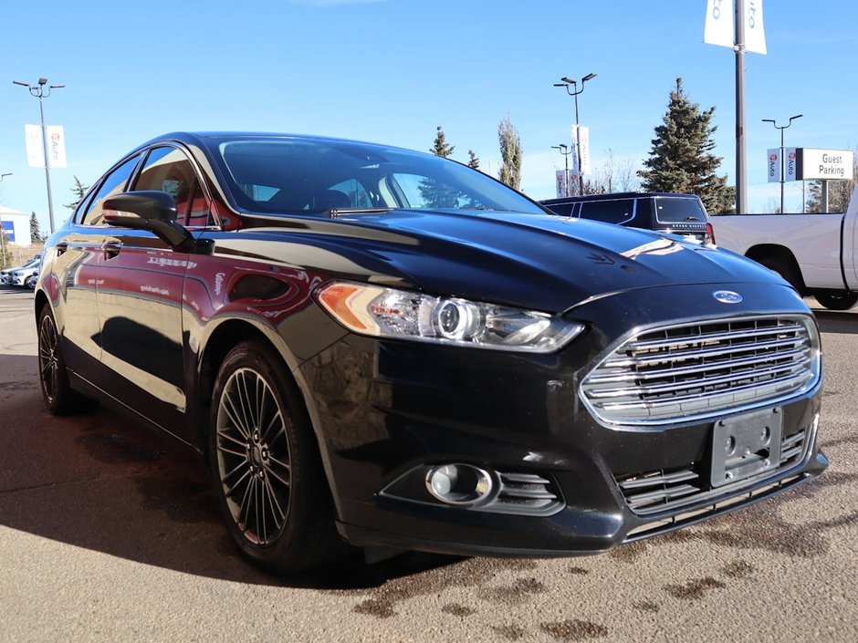 2014 Ford Fusion SE IN BLACK EQUIPPED WITH A 2.0L ECOBOOST I4 , AWD , 6SPD AUTO , LEATHER HEATED SEATS , BLUETOOTH , SW CONTROLS , SUNROOF , 18IN-10