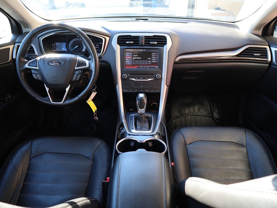 2014 Ford Fusion SE IN BLACK EQUIPPED WITH A 2.0L ECOBOOST I4 , AWD , 6SPD AUTO , LEATHER HEATED SEATS , BLUETOOTH , SW CONTROLS , SUNROOF , 18IN-21