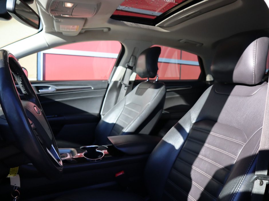 2014 Ford Fusion SE IN BLACK EQUIPPED WITH A 2.0L ECOBOOST I4 , AWD , 6SPD AUTO , LEATHER HEATED SEATS , BLUETOOTH , SW CONTROLS , SUNROOF , 18IN-17