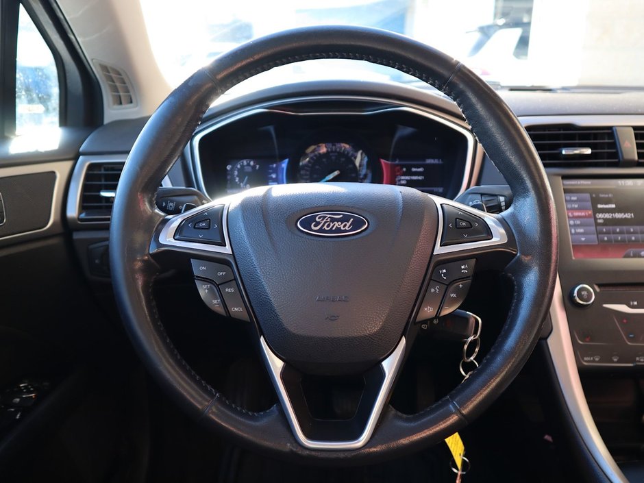 2014 Ford Fusion SE IN BLACK EQUIPPED WITH A 2.0L ECOBOOST I4 , AWD , 6SPD AUTO , LEATHER HEATED SEATS , BLUETOOTH , SW CONTROLS , SUNROOF , 18IN-24