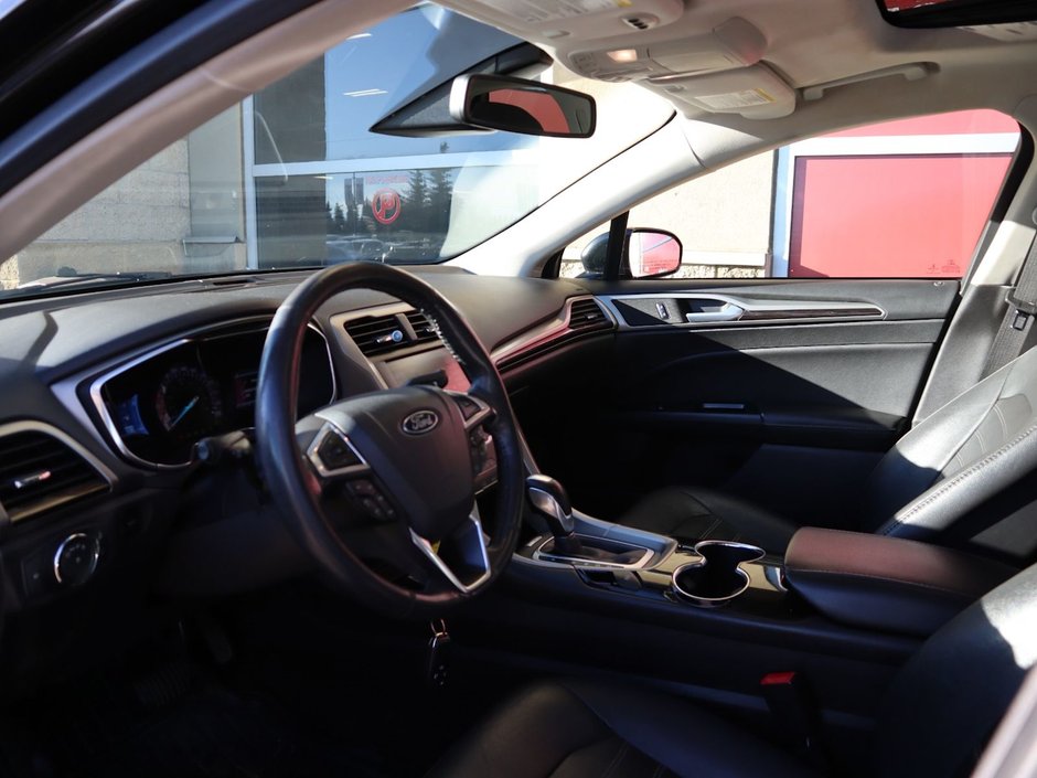 2014 Ford Fusion SE IN BLACK EQUIPPED WITH A 2.0L ECOBOOST I4 , AWD , 6SPD AUTO , LEATHER HEATED SEATS , BLUETOOTH , SW CONTROLS , SUNROOF , 18IN-14