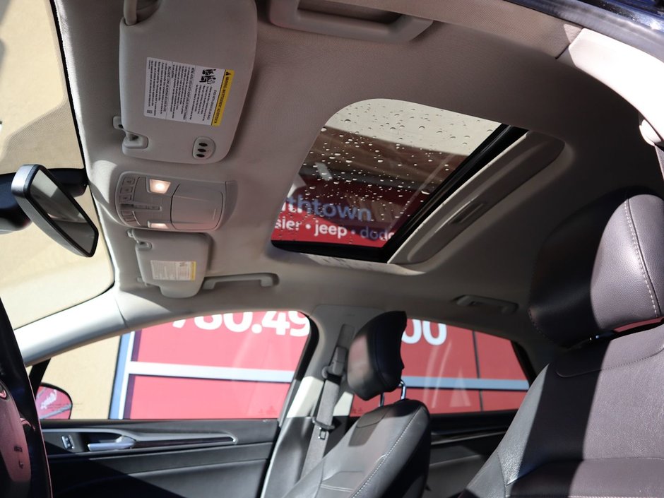 2014 Ford Fusion SE IN BLACK EQUIPPED WITH A 2.0L ECOBOOST I4 , AWD , 6SPD AUTO , LEATHER HEATED SEATS , BLUETOOTH , SW CONTROLS , SUNROOF , 18IN-18