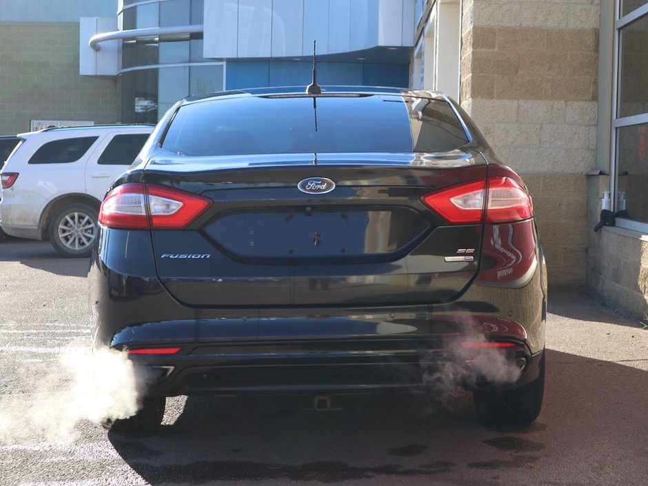 2014 Ford Fusion SE IN BLACK EQUIPPED WITH A 2.0L ECOBOOST I4 , AWD , 6SPD AUTO , LEATHER HEATED SEATS , BLUETOOTH , SW CONTROLS , SUNROOF , 18IN-8