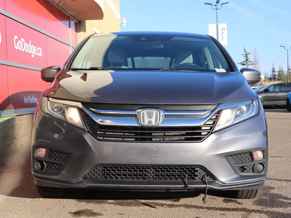 2018 Honda Odyssey LX IN GREY EQUIPPED WITH A 3.5L V6 , FWD , 9SPD AUTO , CLOTH HEATED SEATS , AC , CRUISE , PWR WINDOWS/LOCKS , HONDA RELIABILITY-1