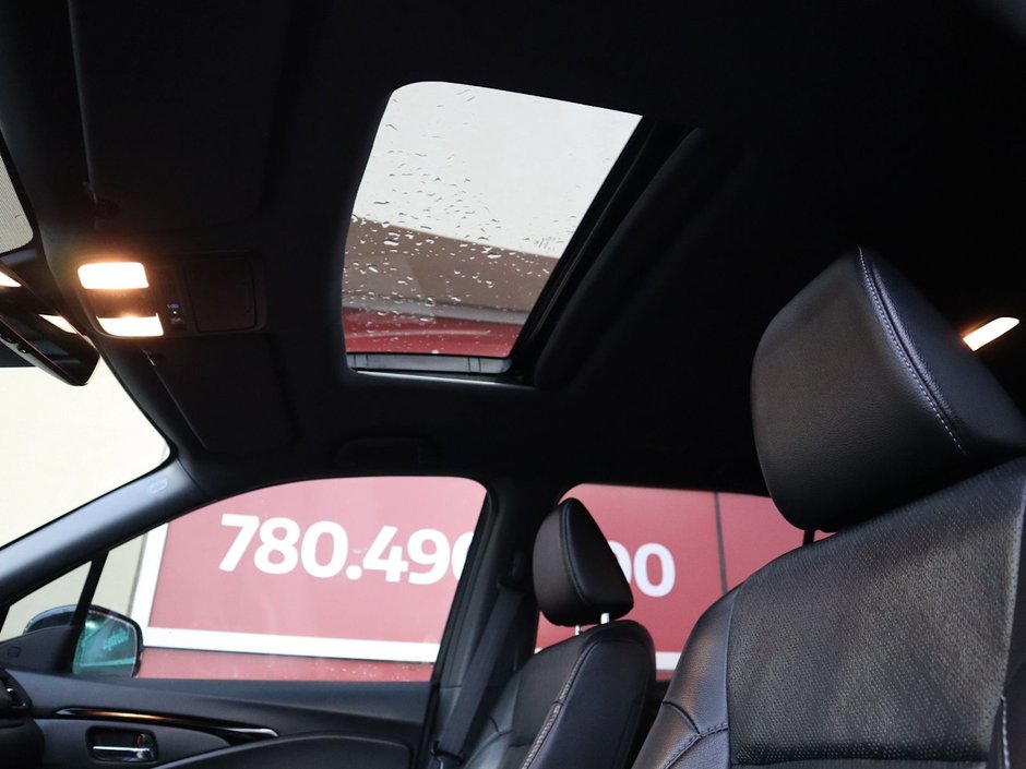 2020 Honda Passport TOURING IN RED EQUIPPED WITH A 3.5L V6 , AWD , 9SPD AUTO , LEATHER HEATED/VENTED BUCKET SEATS , DUAL EXHAUST , NAV , PREMIUM AUD-18