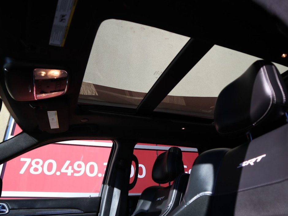 2016 Jeep Grand Cherokee SRT IN BRILLIANT BLACK EQUIPPED WITH A 6.4L SRT V8 , 4X4 , 8SPD TF AUTO , PANORAMIC SUNROOF , 19 SPEAKER HK AUDIO , 20INCH RIMS-18