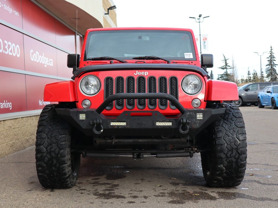 2018 Jeep WRANGLER JK UNLIMITED UNLIMITED SAHARA IN FIRECRACKER RED EQUIPPED WITH A 3.6L V6 , 4X4 , 5SPD AUTO , REMOTE START , AC , HEATED FRONT SEATS , NAV , C-1