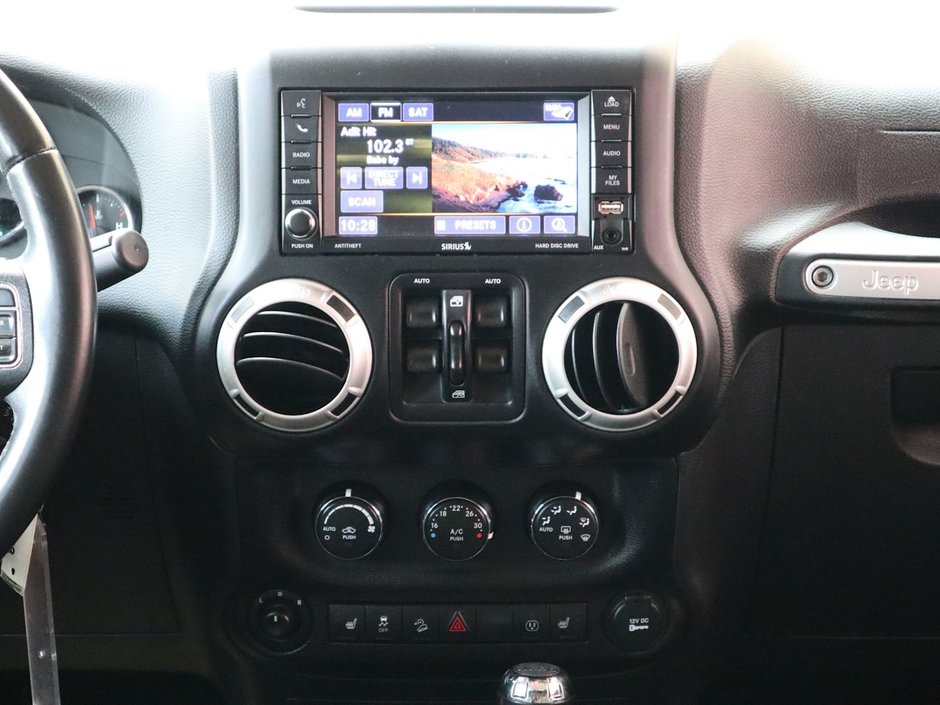 2018 Jeep WRANGLER JK UNLIMITED UNLIMITED SAHARA IN FIRECRACKER RED EQUIPPED WITH A 3.6L V6 , 4X4 , 5SPD AUTO , REMOTE START , AC , HEATED FRONT SEATS , NAV , C-24