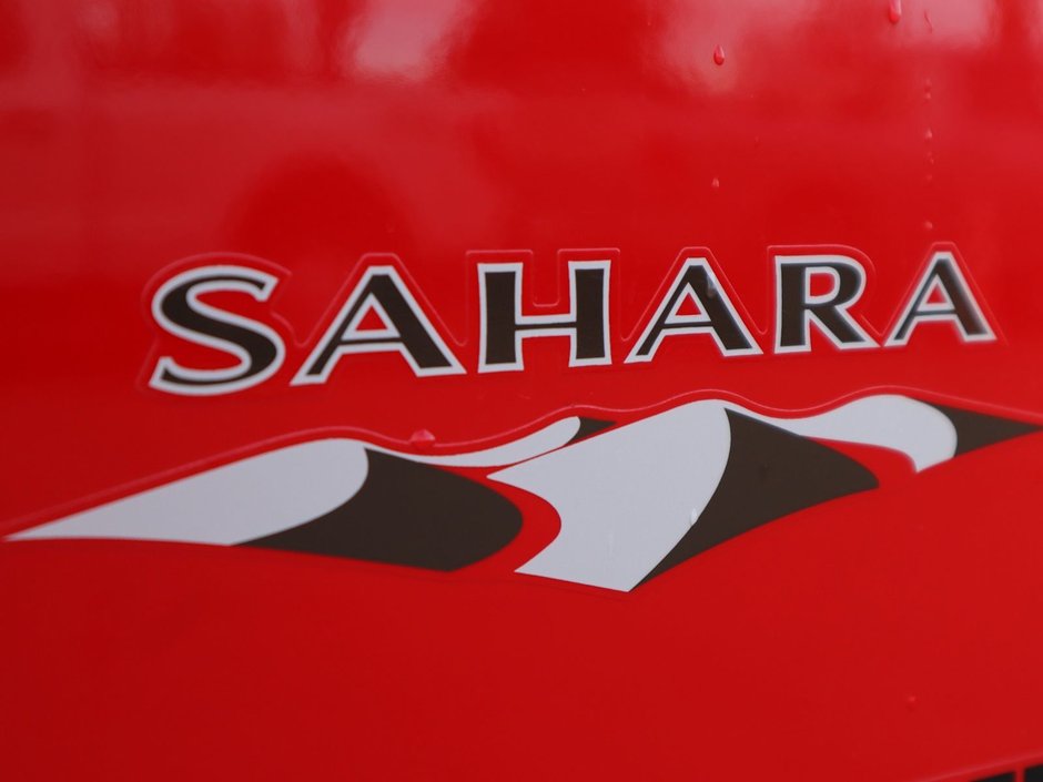 2018 Jeep WRANGLER JK UNLIMITED UNLIMITED SAHARA IN FIRECRACKER RED EQUIPPED WITH A 3.6L V6 , 4X4 , 5SPD AUTO , REMOTE START , AC , HEATED FRONT SEATS , NAV , C-12