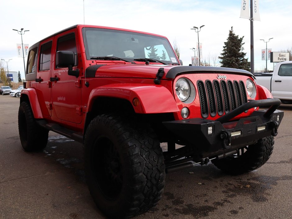2018 Jeep WRANGLER JK UNLIMITED UNLIMITED SAHARA IN FIRECRACKER RED EQUIPPED WITH A 3.6L V6 , 4X4 , 5SPD AUTO , REMOTE START , AC , HEATED FRONT SEATS , NAV , C-10