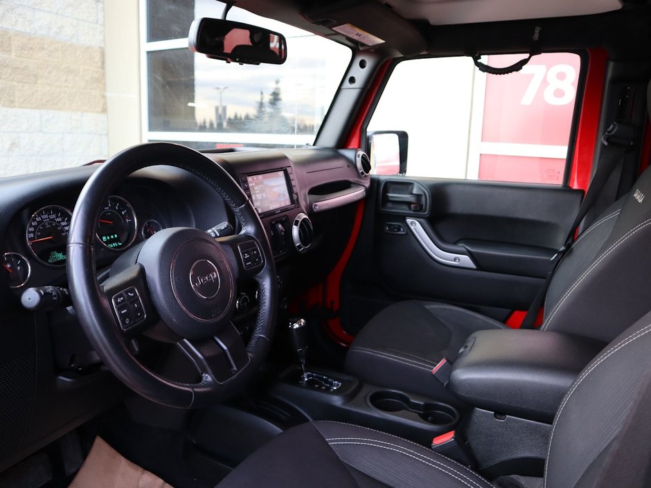 2018 Jeep WRANGLER JK UNLIMITED UNLIMITED SAHARA IN FIRECRACKER RED EQUIPPED WITH A 3.6L V6 , 4X4 , 5SPD AUTO , REMOTE START , AC , HEATED FRONT SEATS , NAV , C-14