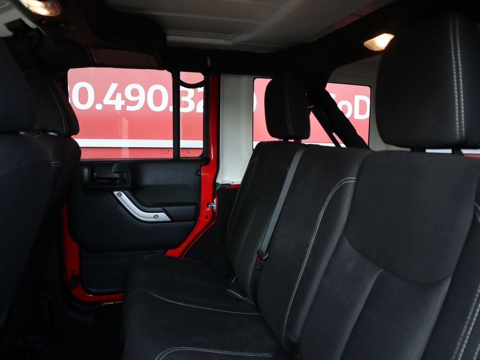 2018 Jeep WRANGLER JK UNLIMITED UNLIMITED SAHARA IN FIRECRACKER RED EQUIPPED WITH A 3.6L V6 , 4X4 , 5SPD AUTO , REMOTE START , AC , HEATED FRONT SEATS , NAV , C-19