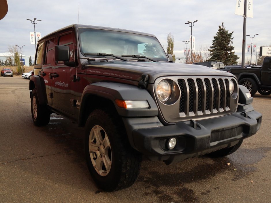 2019 Jeep Wrangler Unlimited SPORT IN GRANITE METALLIC EQUIPPED WITH A 2.0L TURBO I4 W/ETORQUE , 4X4 , 8SPD AUTO , 17INCH RIMS , ANTI SLIP DIFF REAR , COLD W-9