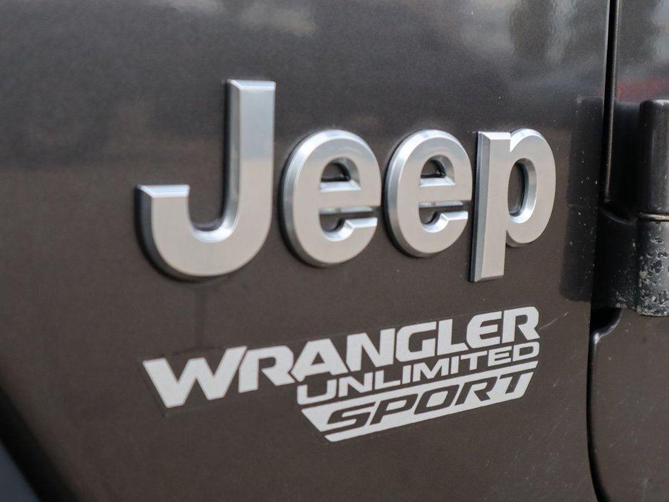 2019 Jeep Wrangler Unlimited SPORT IN GRANITE METALLIC EQUIPPED WITH A 2.0L TURBO I4 W/ETORQUE , 4X4 , 8SPD AUTO , 17INCH RIMS , ANTI SLIP DIFF REAR , COLD W-11