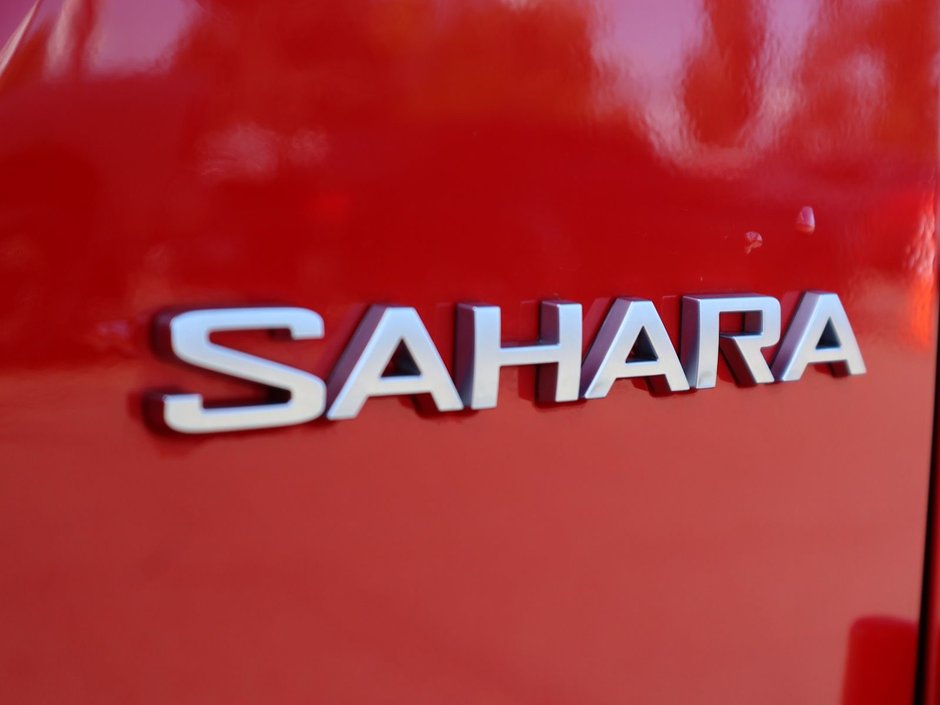 2023 Jeep Wrangler SAHARA IN FIRECRACKER RED EQUIPPED WITH A 3.6L V6 W/ETORQUE , 4X4 , 8SPD TF AUTO , HARDTOP , SIDE STEPS , LSD , LED LIGHTING , T-13