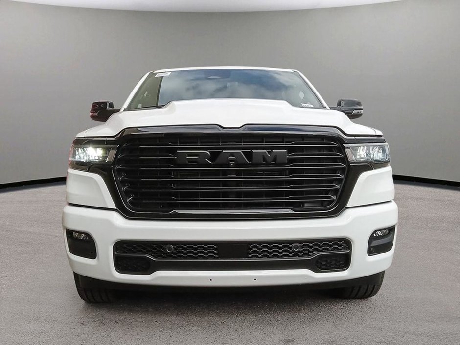 2025 Ram 1500 LARAMIE IN BRIGHT WHITE EUQIPPED WITH A 3.0L TWIN TUBRO I6 , 4X4 , 8SPD AUTO , HANDS FREE DRIVING ASSIST , AIR SUSPENSION , 125L-1
