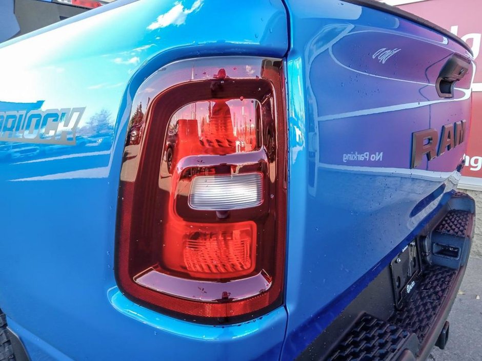 2025 Ram 1500 WARLOCK IN HYDRO BLUE EQUIPPED WITH A 3.0L TWIN TUBRO HURRICANE I6 , 4X4 , 8SPD AUTO , E LOCKER REAR AXLE , BACKUP CAM , PERF SH-10