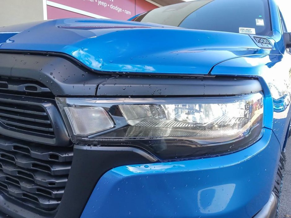 2025 Ram 1500 WARLOCK IN HYDRO BLUE EQUIPPED WITH A 3.0L TWIN TUBRO HURRICANE I6 , 4X4 , 8SPD AUTO , E LOCKER REAR AXLE , BACKUP CAM , PERF SH-7