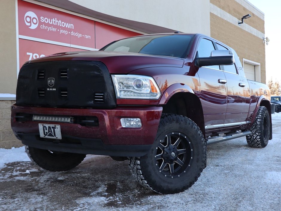 2017 Ram 2500 LIMITED MEGA CAB IN RED PEARL EQUIPPED WITH A 6.7L CUMMINS TURBO DIESEL I6 , 4X4 , 6SPD AUTO , REAR AUTO LVL AIR SUSPENSION , SU-0