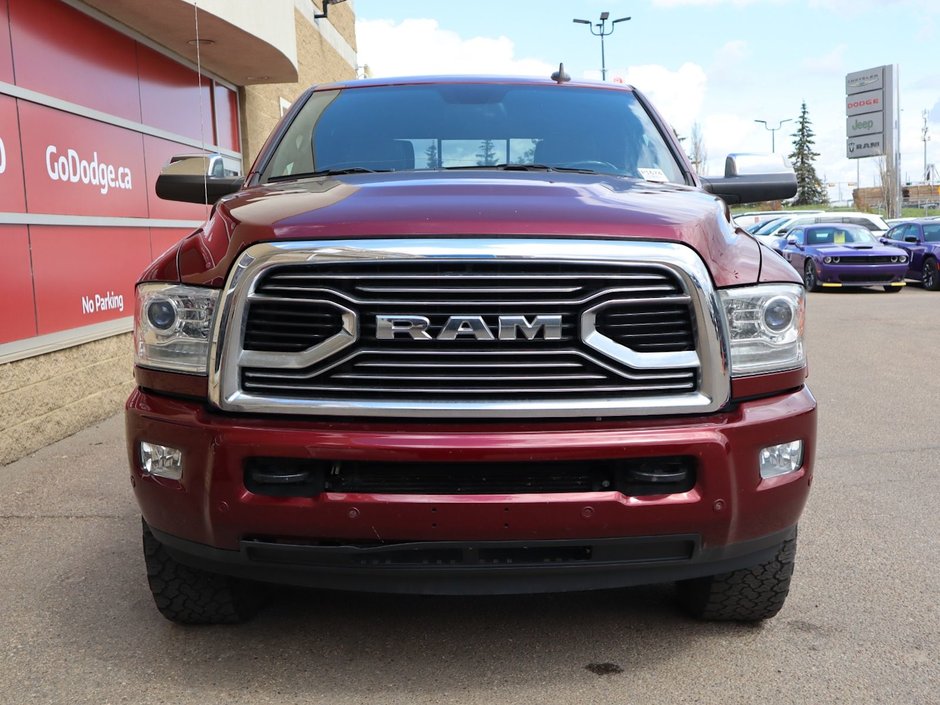 2018 Ram 3500 LIMITED IN RED PEARL EQUIPPED WITH A 6.7L CUMMINS TURBO DIESEL I6 , 4X4 , 6SPD AUTO , RUNNING BOARDS , 5TH WHEEL & GOOSENECK TOW-1
