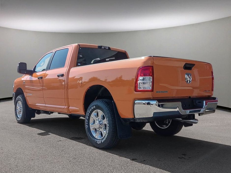 2024 Ram 3500 BIG HORN IN OMAHA ORANGE EQUIPPED WITH A 6.7L CUMMINS HO TURBO DIESEL I6 , 4X4 , 6SPD AISIN HD AUTO , 12INCH W/NAV , ALPINE AUDI-3